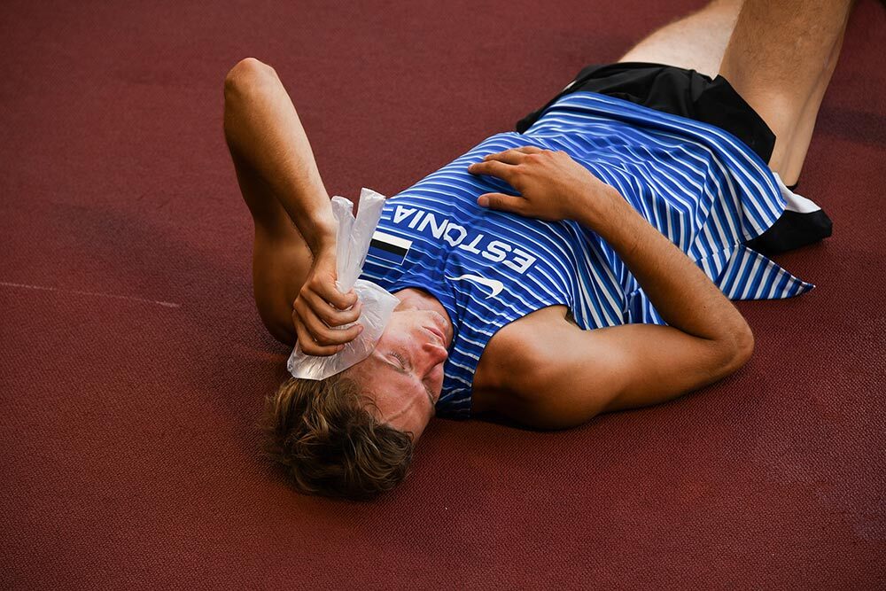 An athlete cools off with a bag of ice during the Tokyo 2020 Olympic Games.