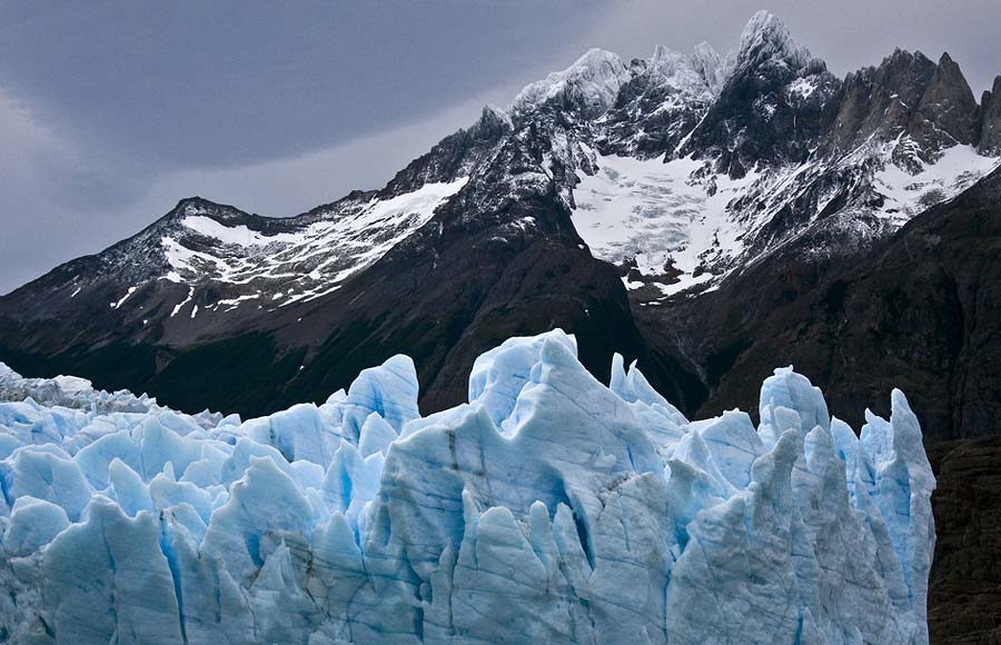 Patagonia mountains surround a glacier. 