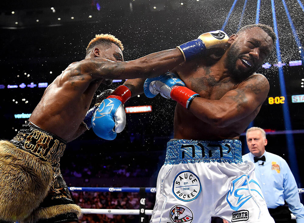 Jermell Charlo (gold shorts) fights Austin Trout (white shorts) in their WBC Super Welterweight Title bout at Staples Center on June 9, 2018 in Los Angeles, California. Charlo won by decision.