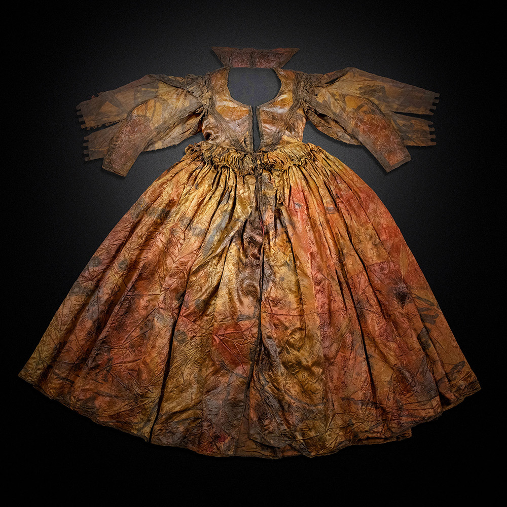 A dress found in a shipwreck on display in a museum