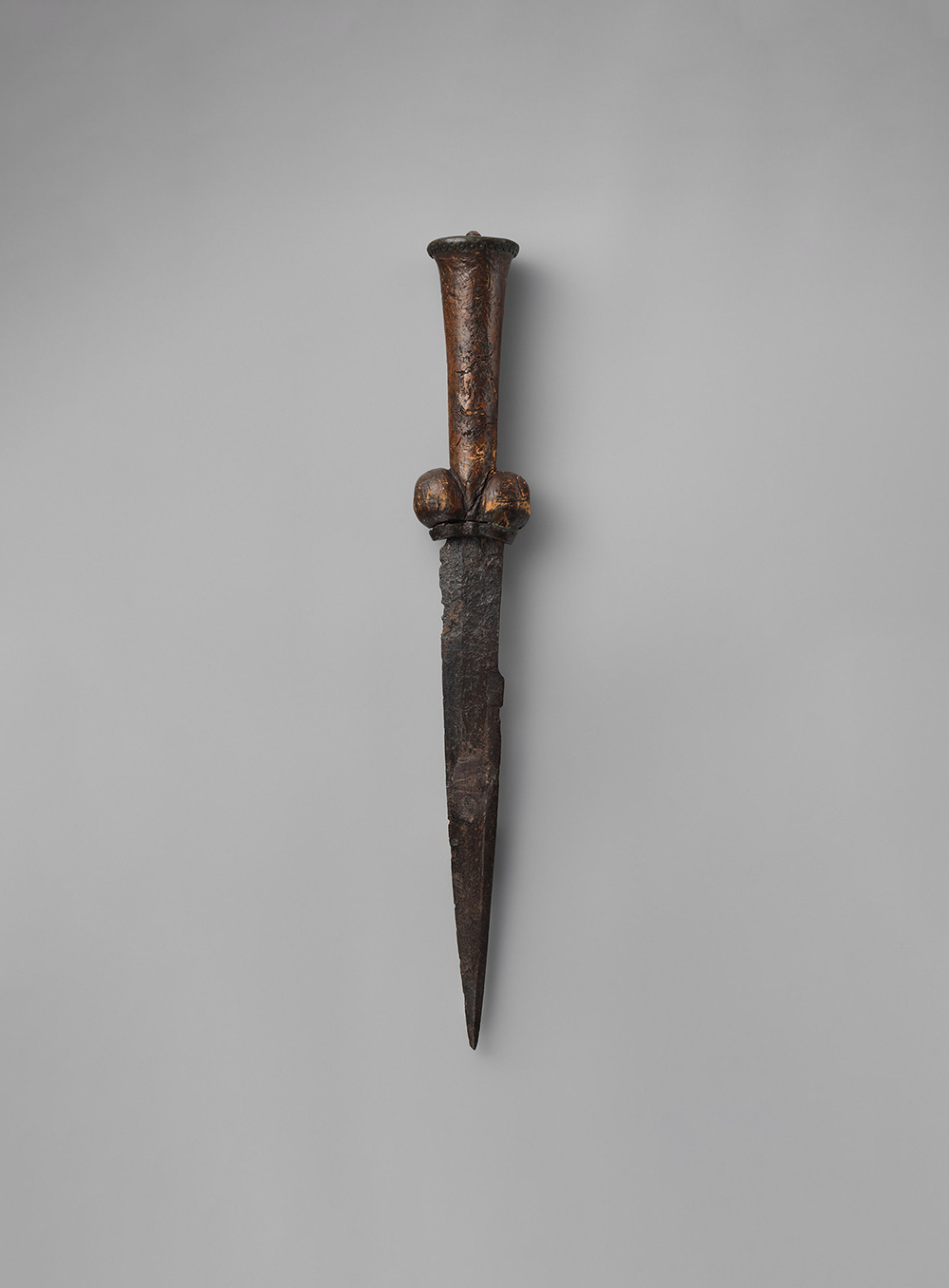 This 14th-century bollock knife, named for its distinctive hilt, was commonly used in the European Middle Ages as an eating utensil, tool, and weapon. Often referred to as a "kidney dagger," it would have been carried by many medieval students at Oxford—an uncommon number of whom apparently harbored murderous intent.