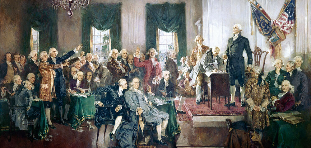 A painting of Washington overseeing the signing of the Constitution at Independence Hall