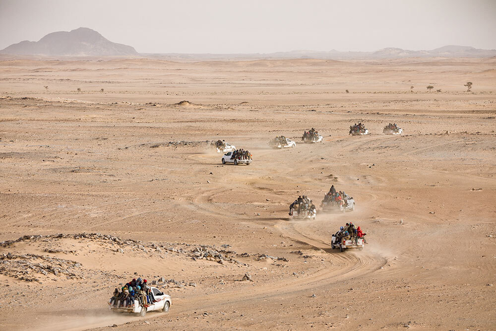 A convoy of pickups packed with Nigeriens and other Africans begins a three-day trek from Agadez, Niger, through the Sahara to Libya. Many migrants intend to work there; others hope to reach Europe.