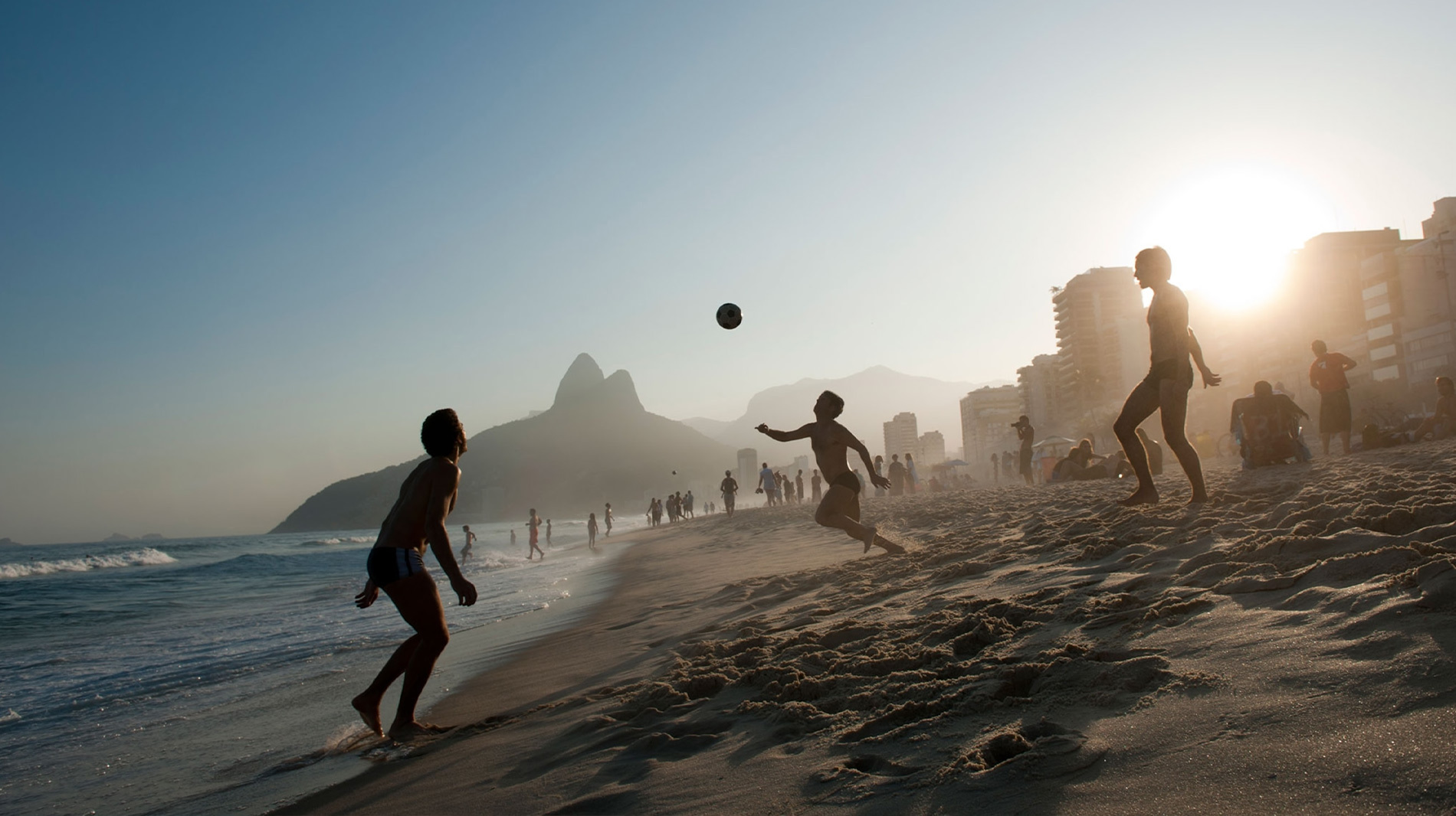 Locals play soccer on one of Rio de Janeiro's famed beaches.