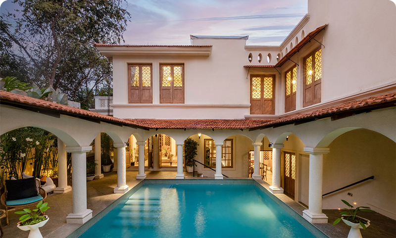 Lounge beside the private pool of your vacation home in Goa, India.