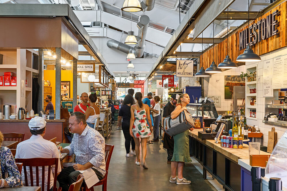 people walk through a public market in Napa city