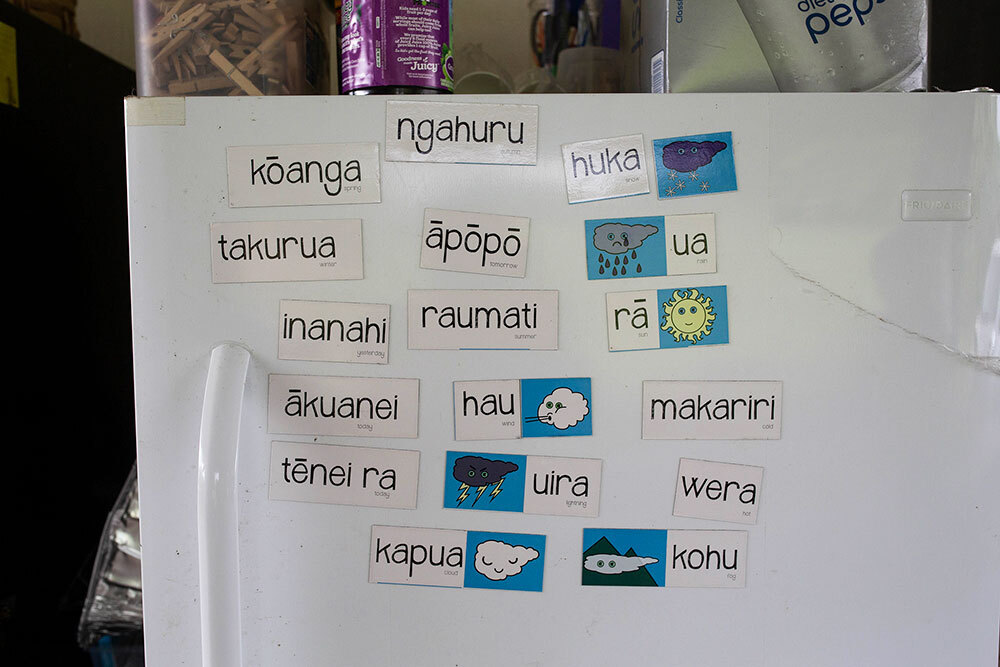 magnets with Maori vocabulary words on a refrigerator door