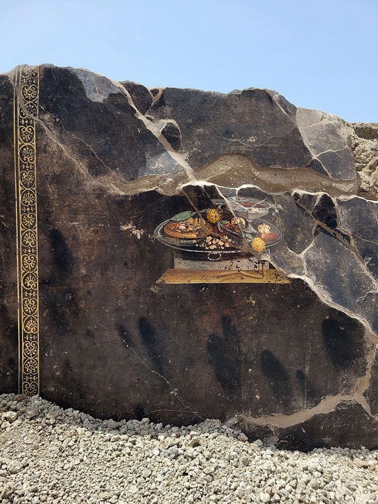 This fresco discovered in Pompeii may look like a 2,000-year-old pizza but archaeologists say it can't be—tomatoes weren't grown in Italy at the time. Still, excavations of the city preserved in volcanic ash have yielded fascinating insights into what Pompeiians truly did eat.