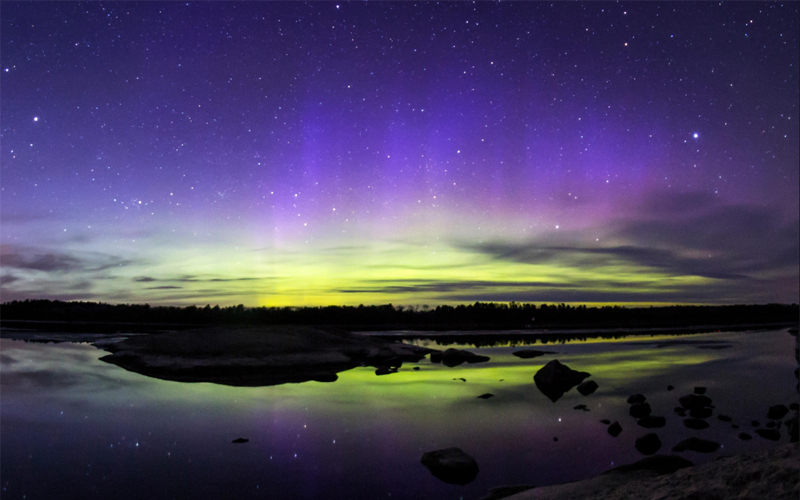 Northern lights, which the Ojibwe call “Wawatay,” dance across the sky over Voyageurs National Park in northern Minnesota, one of the darkest places in the contiguous United States.