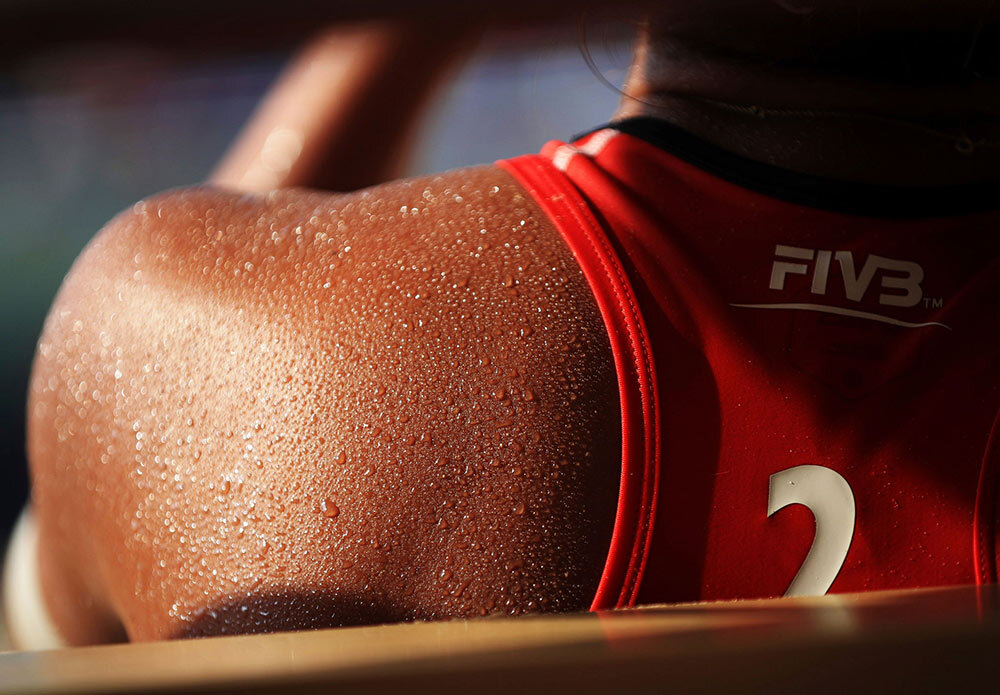 An athlete sweating. Humans cool their bodies through the evaporation of sweat. Although this technique works well for the dry African savannas where humans evolved, it’s much less effective in humid climates.