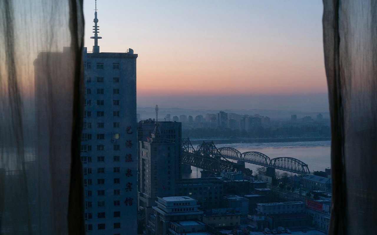 The sun sets over Dandong, China.