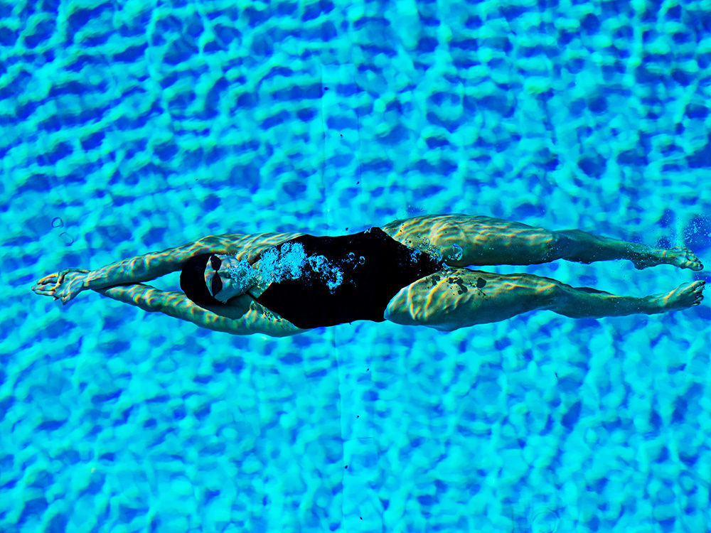 Katie Ledecky in blue water of a swimming pool