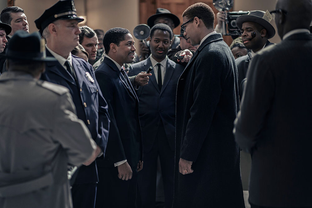 Martin Luther King Jr., played by Kelvin Harrison Jr., and Malcolm X, played by Aaron
Pierre, are surrounded by reporters
in the US Senate as seen in GENIUS: MLK/X.