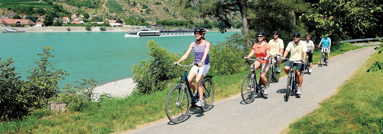 Travelers pedal through the riverside villages of Austria's Wachau Valley.
