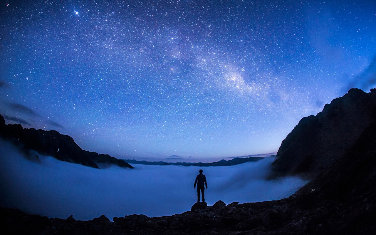A visitor soaks in the starry sky at Nelson Lakes National Park.