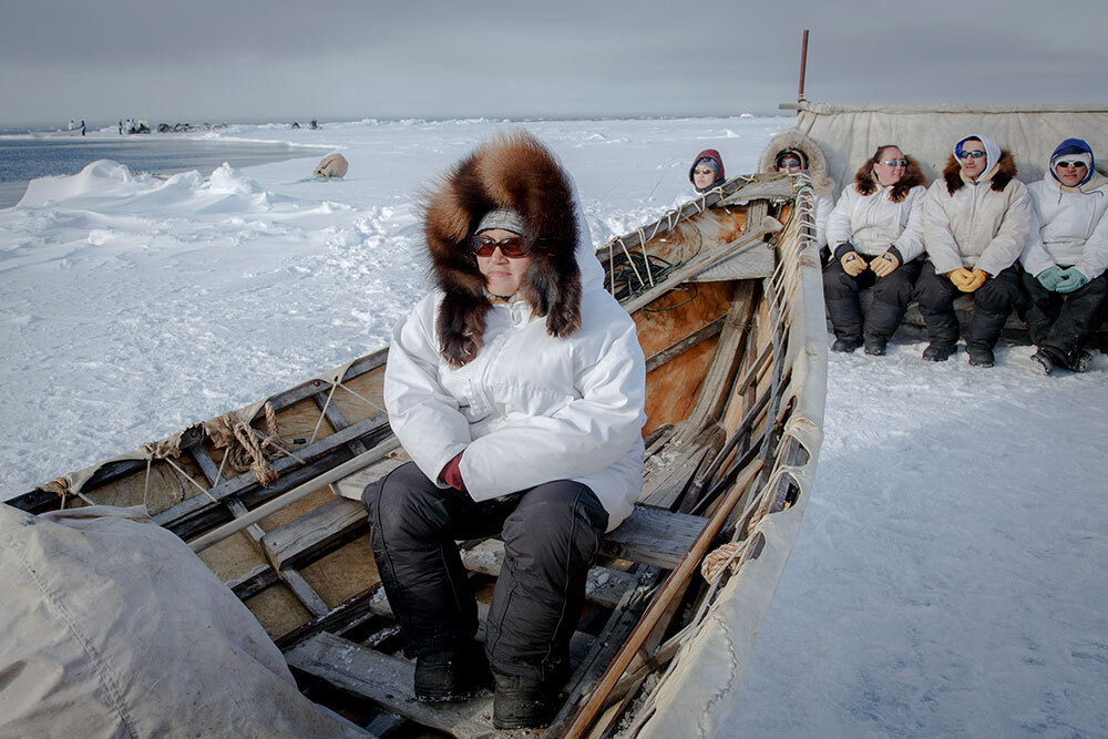 A picture of a group of people on the ice in Alaska