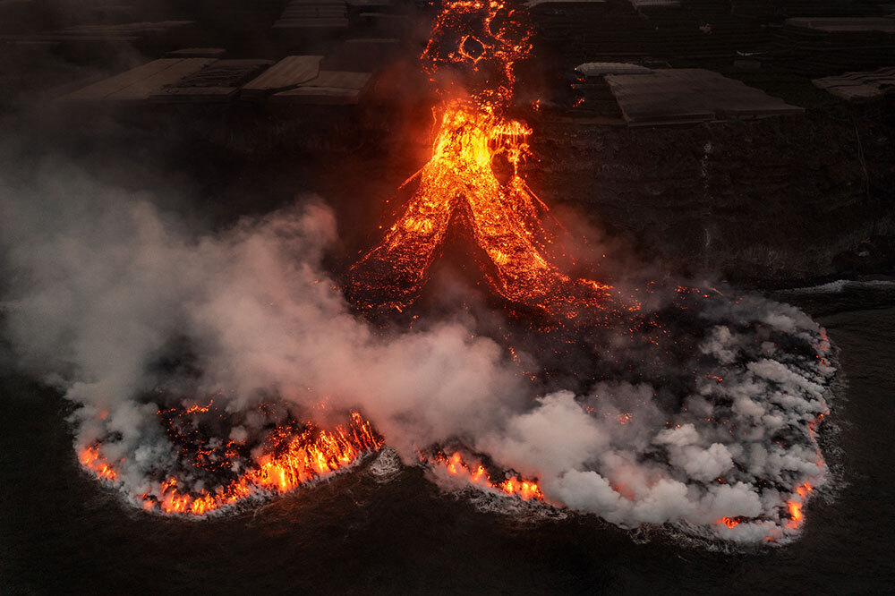 Plumes of steam from the ocean where the lava hits