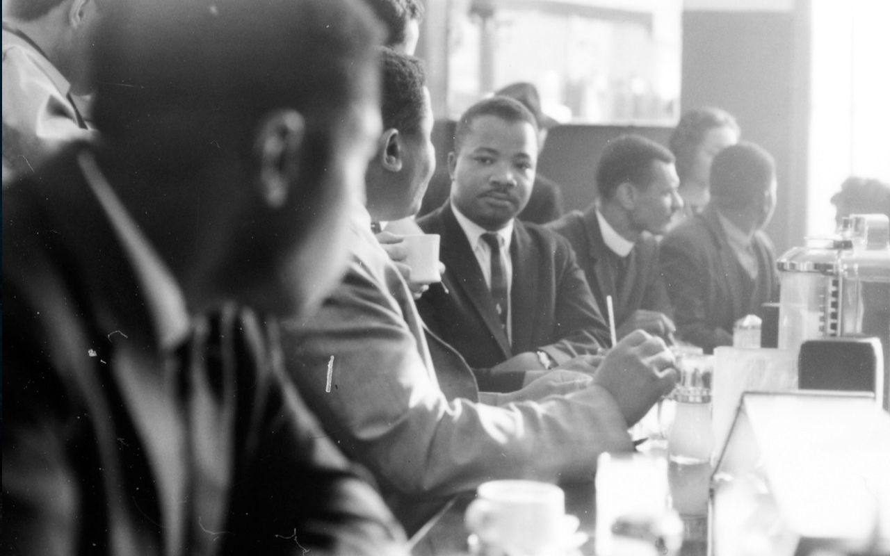 Martin Luther King Jr. and his fellow Freedom Riders often met to talk strategy over meals. Here they are at a bus station in May of 1961.