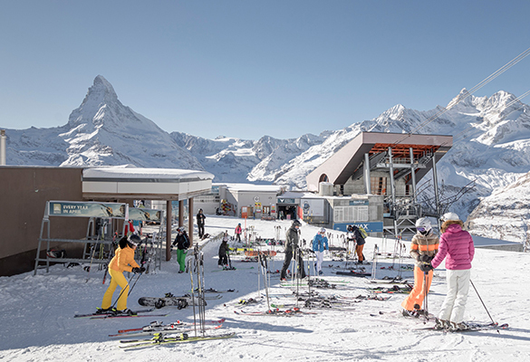 In Switzerland, skiers gear up at a Zermatt ski resort, with the Matterhorn looming in the background.