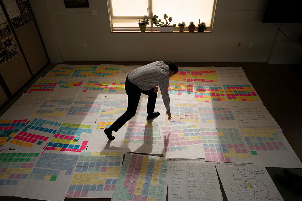 A man stand on paper on the floor