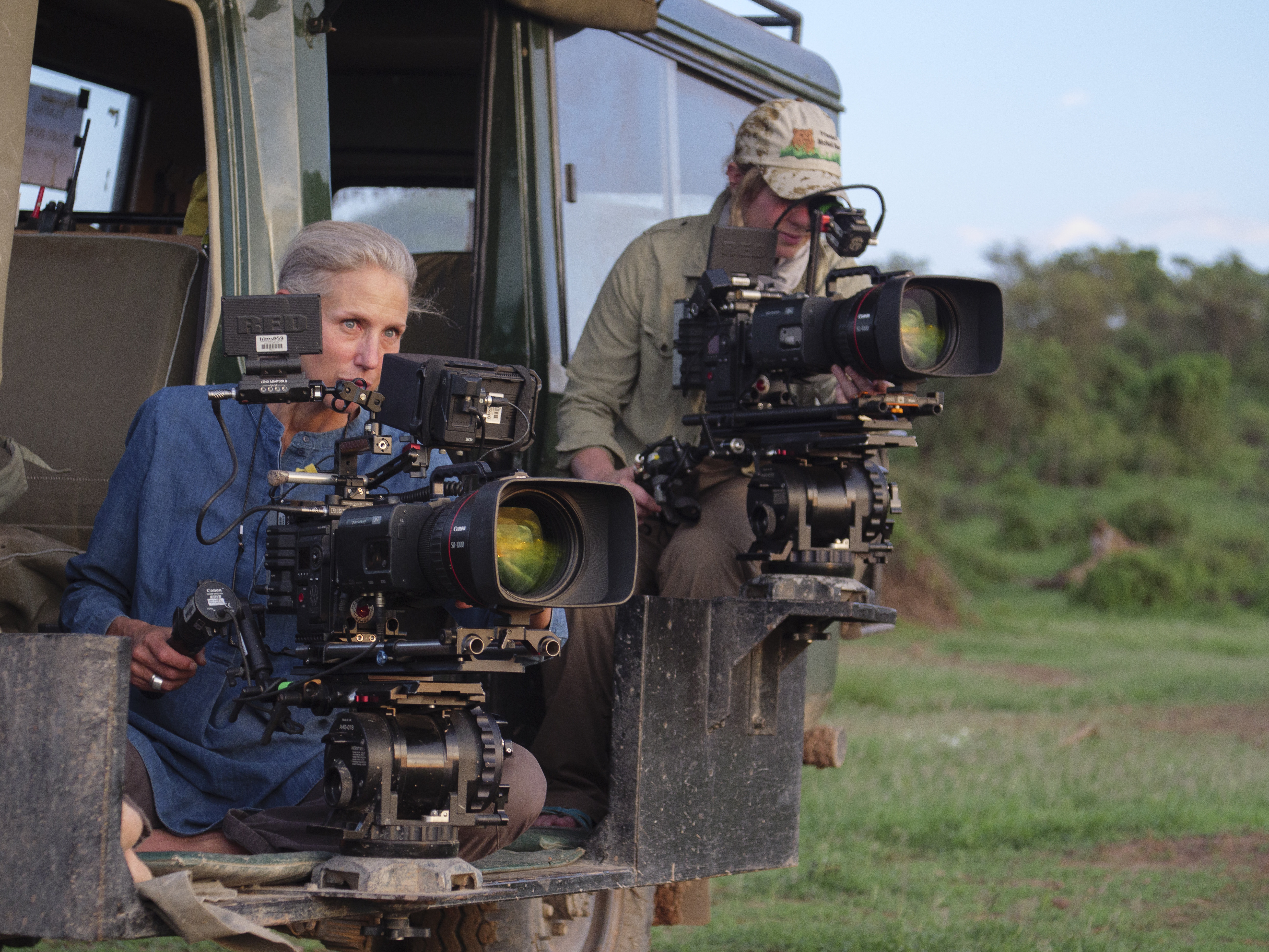 Queens' Director of Photography Sophie Darlington and Cinematographer and mentee
Erin Ranney film elephants from the vehicle. (National Geographic for Disney+/Faith
Musembi)