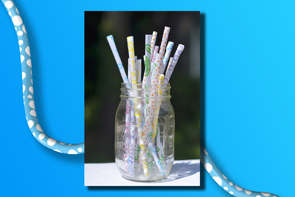 A mason jar full of straws