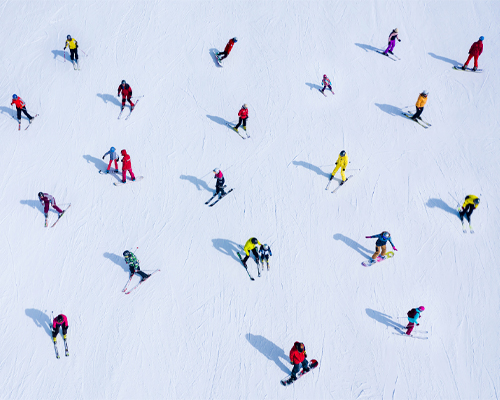 A group of skiers skiing downhill