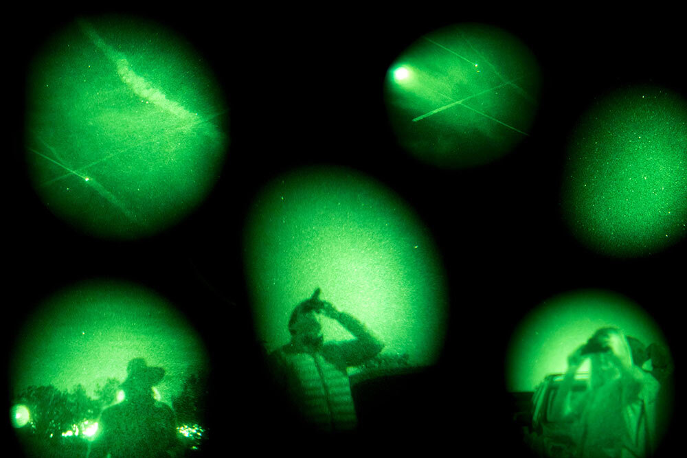 UFO believers look for suspicious spacecraft during a UFO and Vortex Tour in Sedona, Arizona. This composite image is a combination of six photographs taken in 2017 through night vision goggles.