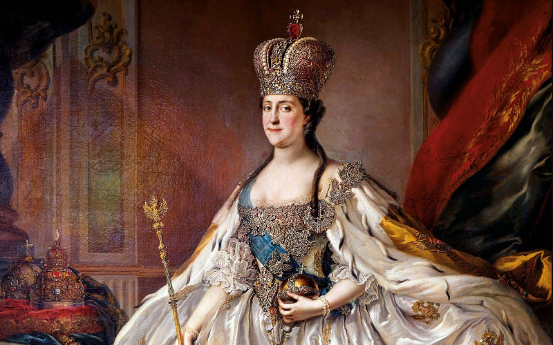 Catherine’s coronation portrait: Topped by a sparkling diamond crown, she displays the royal regalia and is draped with the blue sash of St. Andrew, the highest honor of the Russian Empire.  