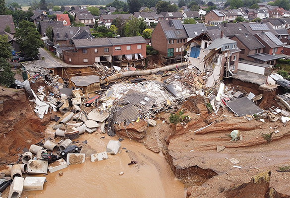 Heavy rainfall resulting from a slow-moving low-pressure system over western Germany led to catastrophic damage and loss of life. Houses like the one shown here caved in after mudslides and sinkholes opened throughout the region.