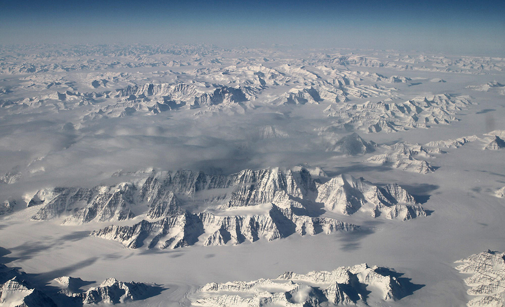 A portion of Greenland's ice sheet along the northeast coastline is seen from 40,000 feet