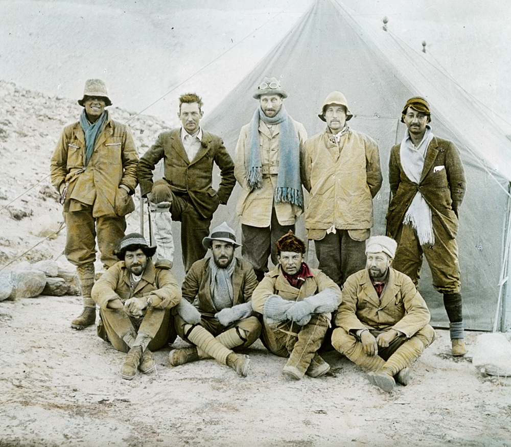 Four men sitting in front of five men standing