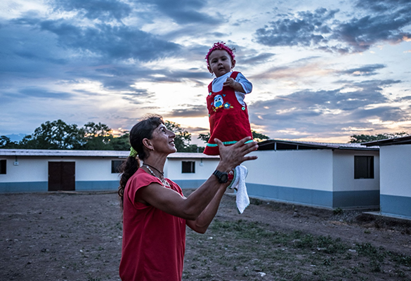 Former FARC fighter Esperanza Medina holds her seven-month-old daughter, Desiree Paz, at the transitional and normalization zone in Pondores, La Guajira, Colombia.