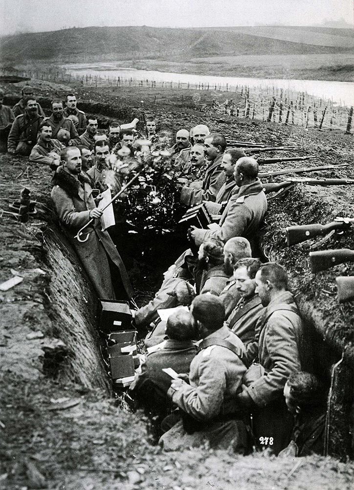 In the early months of World War I, German soldiers decorate their trench with Tannenbäume, or fir trees.