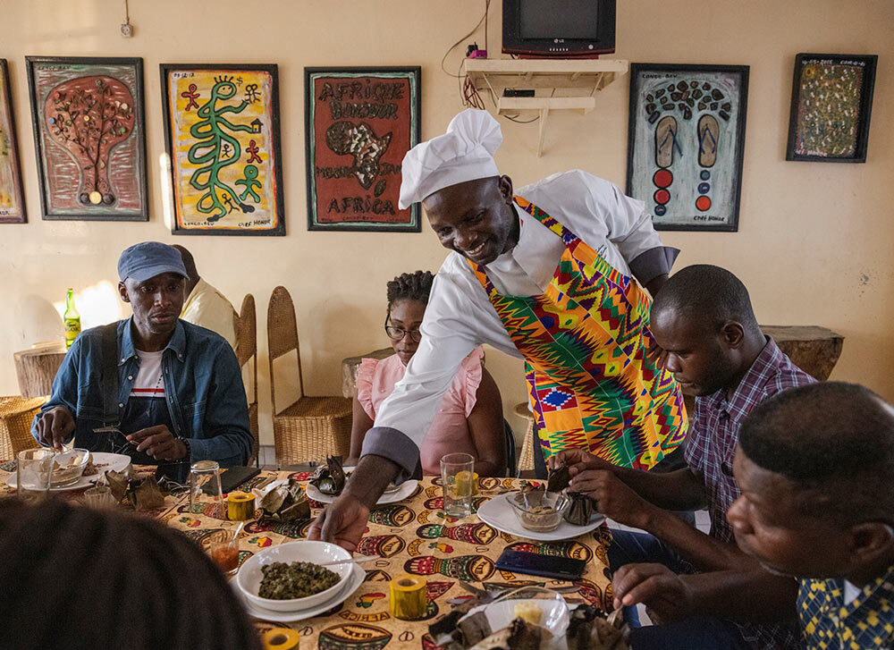 a chef serves his guests