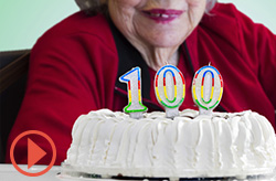 Birthday cake and elderly woman