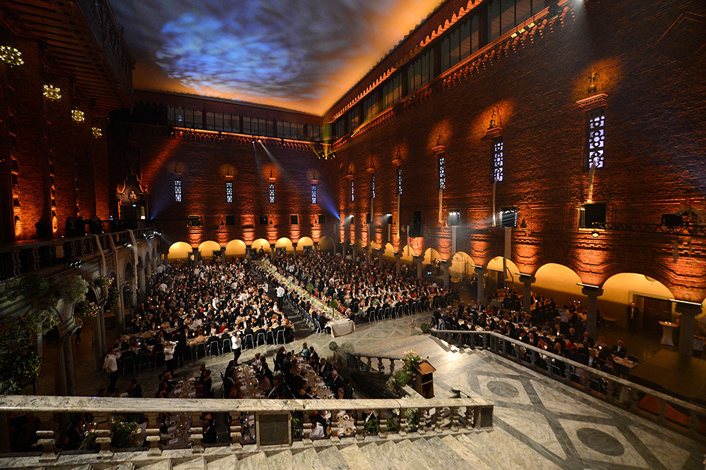 Recipients and guests participate in a celebratory dinner at Stockholm City Hall after the annual Nobel Prize ceremony.