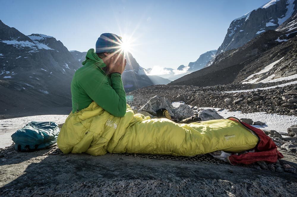 Waking up can leave you groggy but experts say that exposure to sunlight in the morning is key to helping your body adjust—as this hiker likely discovered while waking up in the Skjoldungen range of Greenland.