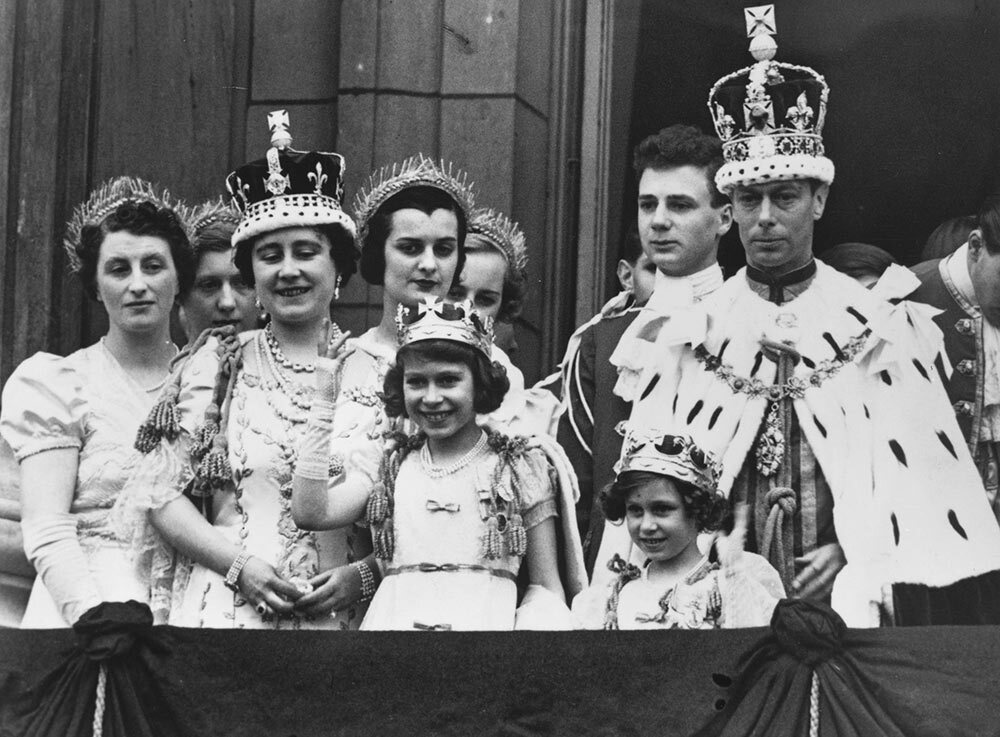 Princess Elizabeth (center) and the rest of the royal family greet the crowd after the coronation ceremony for her father, King George VI, in May 1937.