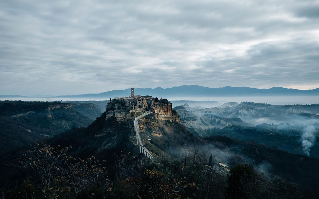 The Italian village of Civita di Bagnoregio is disappearing. Every year, seven centimeters of land tumbles into the ravine below and only seven people still call the place home. However, one million tourists stopped by to see it in 2019.