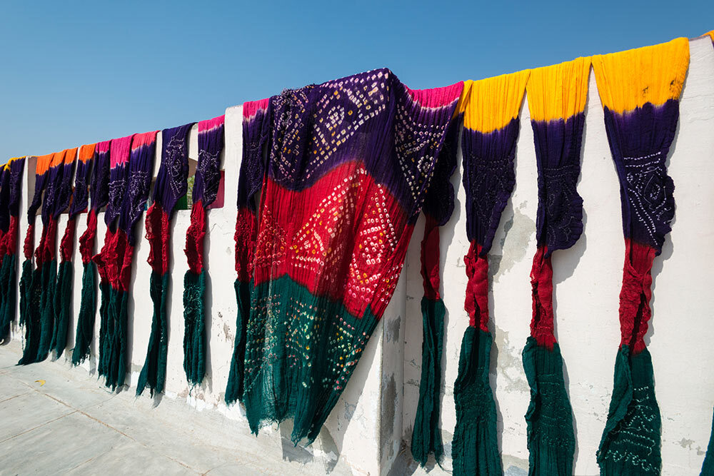 tie-dyed scarves hanging to dry