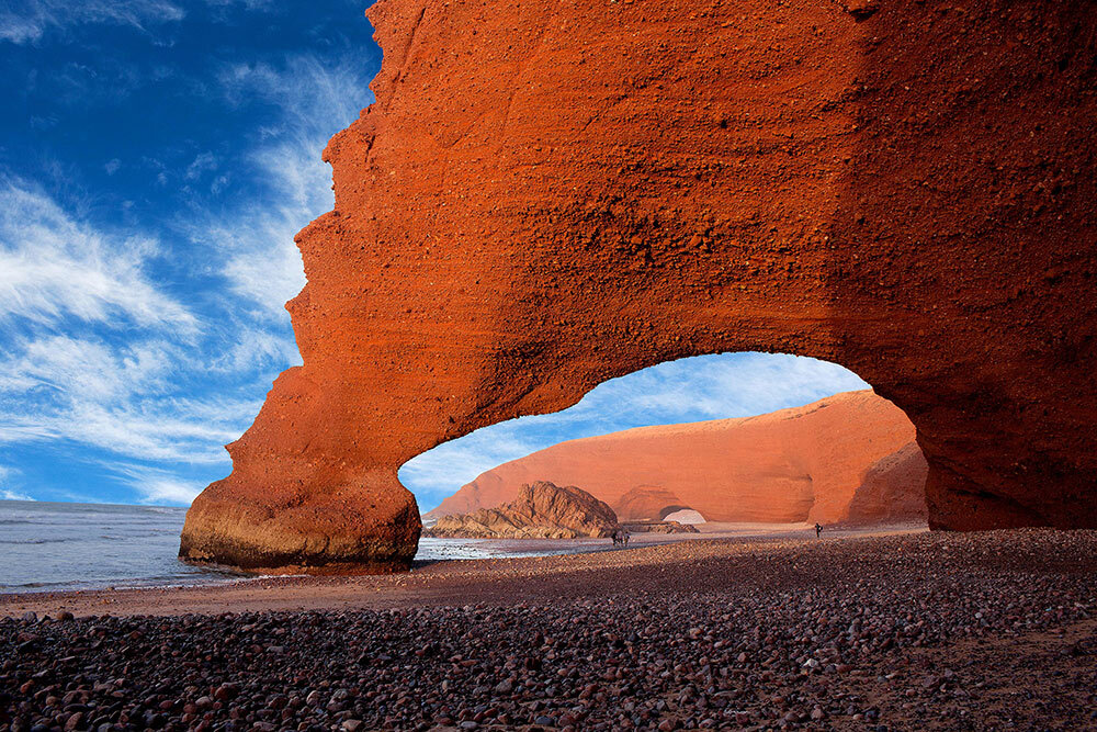 twin red sea arches on a beach