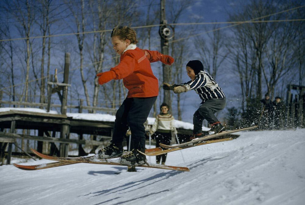 Six-year-olds practice ski jumps with gusto in Lac Beauport, Quebec, Canada.