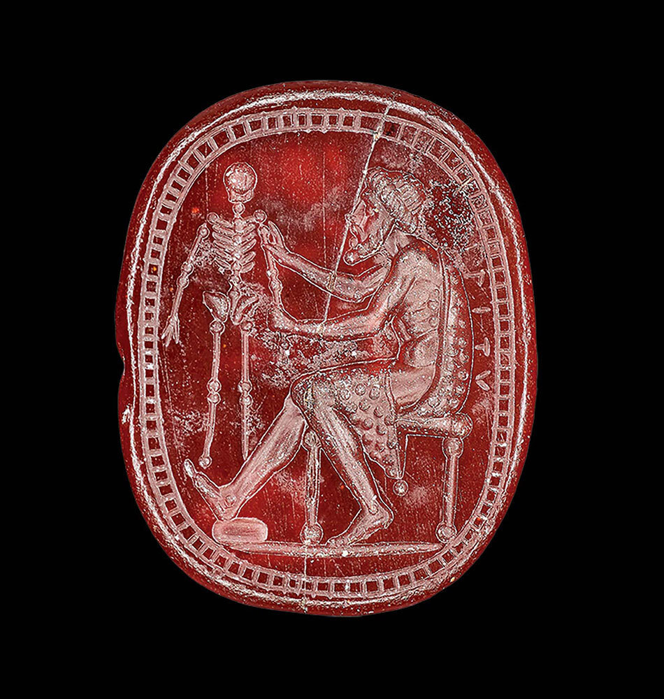 A carving on a red scarab