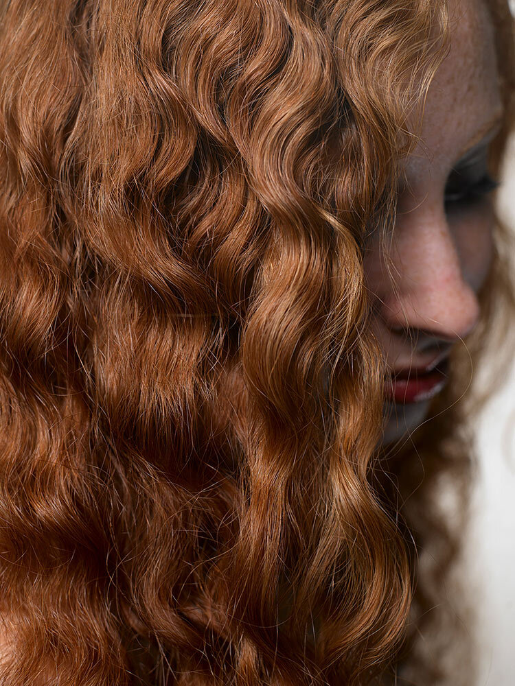 a woman with curly hair