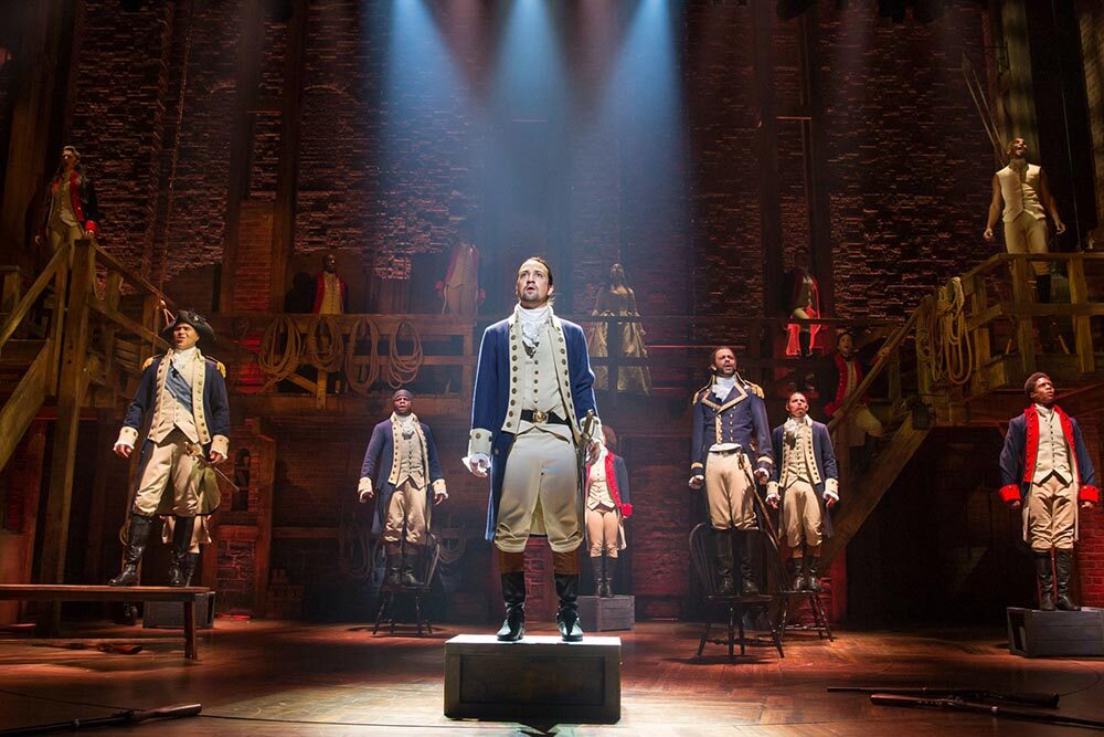 Lin-Manuel Miranda, creator and star of “Hamilton,” stands center with the original ensemble cast on Broadway in 2015.