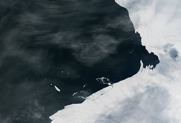 Pine Island Glacier sheds another block of ice into Antarctic waters. A new study finds that unless major nations quickly commit to deeper cuts in emissions, Antarctica’s ice could reach a melting tipping point by mid-century, sparking dangerous sea level rise.