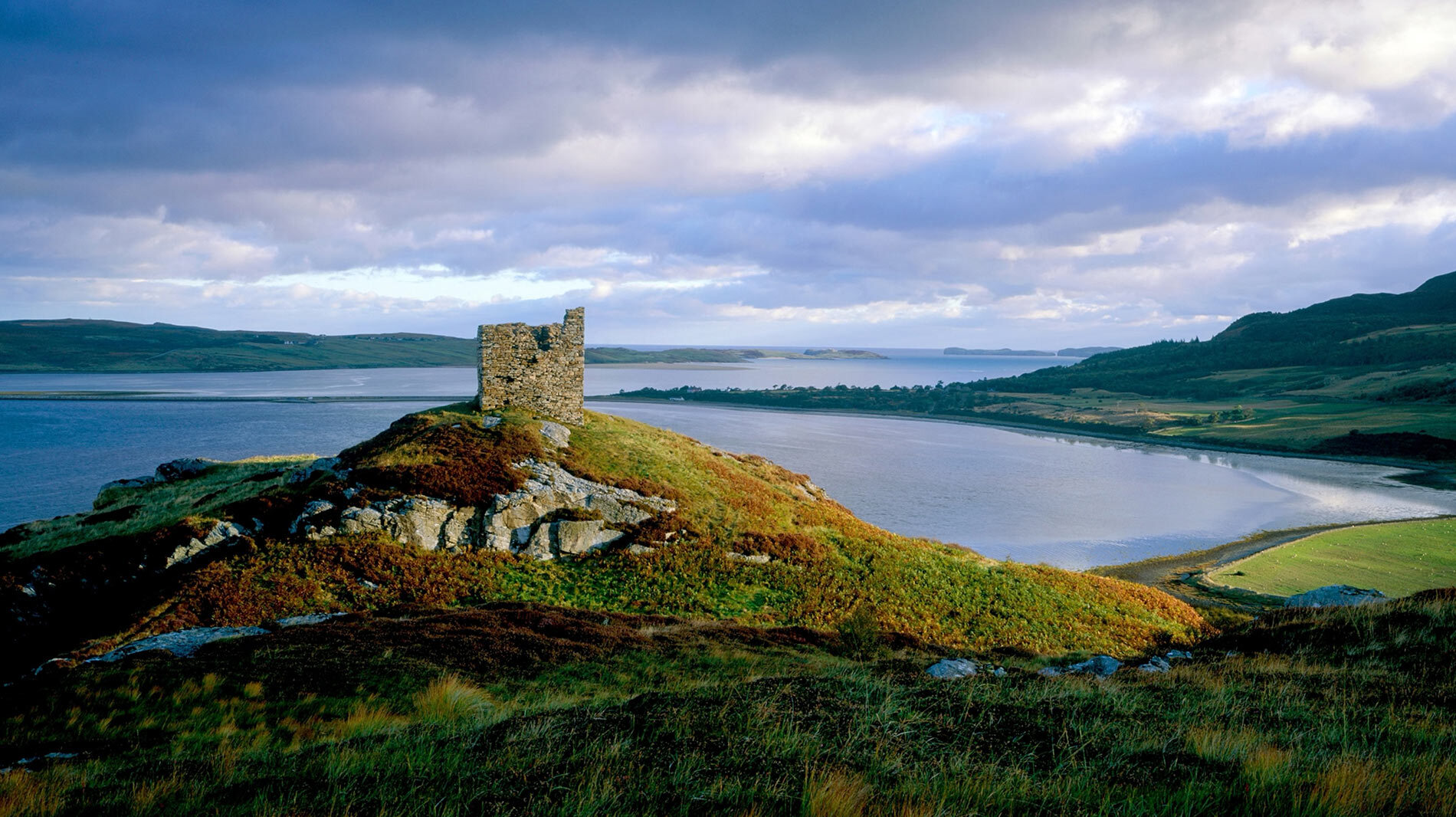 Castle Varrich rises above Kyle of Tongue, a shallow sea loch, on northern Scotland’s A’ Mhòine peninsula.