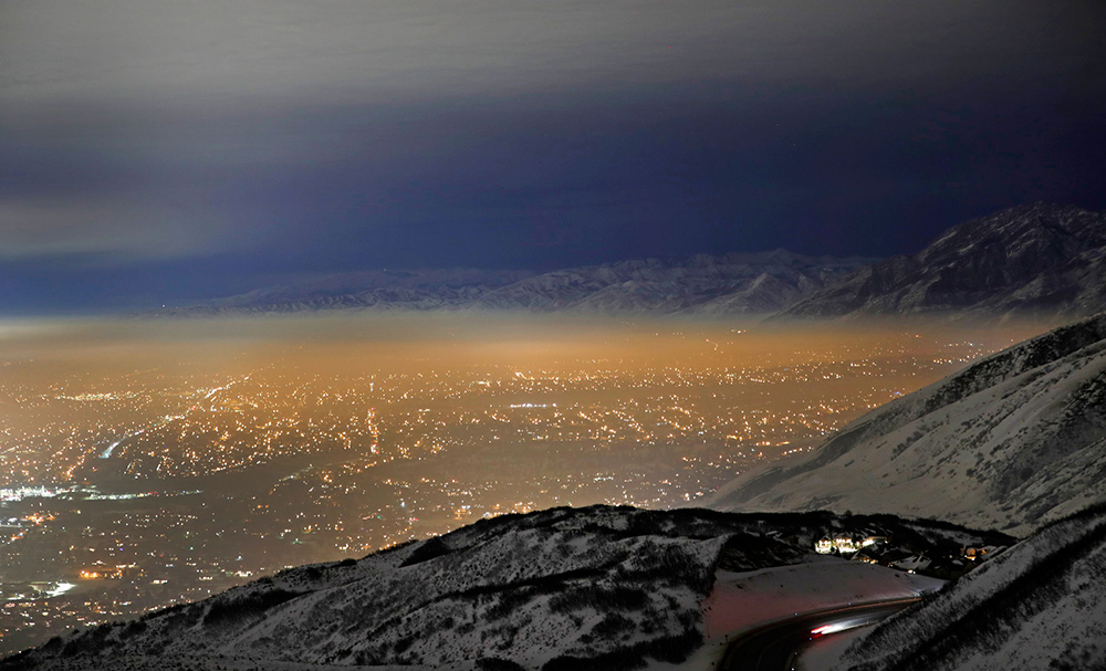 light shines through the smoggy inversion layer trapped over the Salt Lake Valley