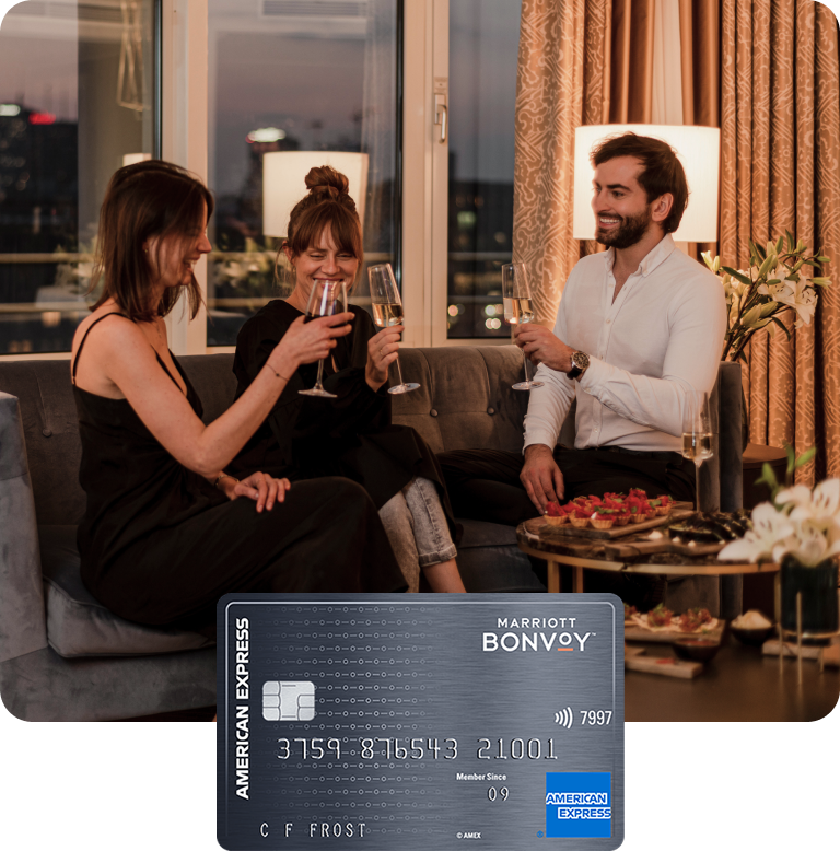 Three guests in a hotel bar in Warsaw, Poland, making a toast before savoring culinary delights.